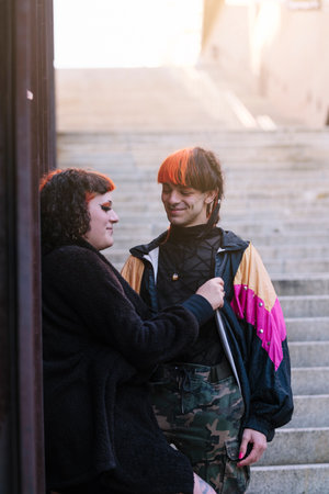 Couple of a boy with a transgender girl with an urban look.