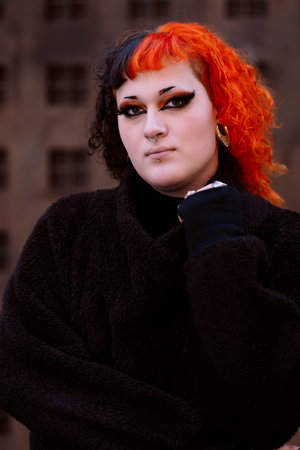 Transgender girl with painted hair posing to the camera.の写真素材