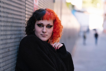 Transgender girl with painted hair posing to the camera.の写真素材
