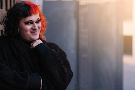 Transgender girl with painted hair posing to the camera.の写真素材