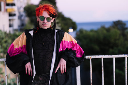 Portrait of a boy with urban appearance with painted hair.の写真素材