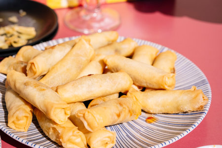 Small Chinese spring rolls with sweet and sour sauce.の写真素材