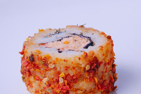 Sushi with dried tomato species on the outside.の写真素材