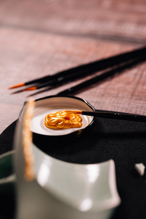 Kintsugi concept. Gold glue to join broken ceramics.の写真素材