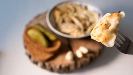 dumpling on a fork white backgroundの写真素材