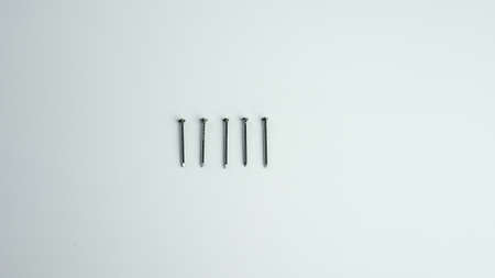 five nails on a white backgroundの写真素材