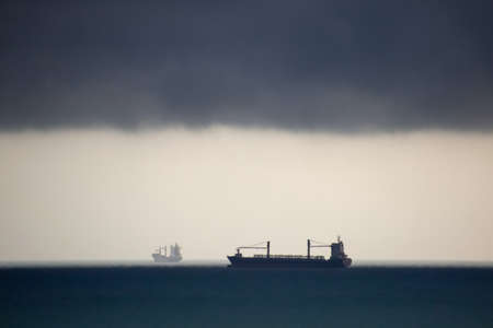two ships at sea in cloudy weather.の写真素材