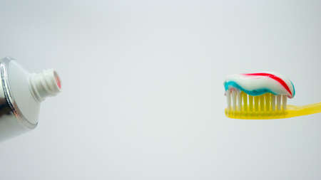 toothbrush with toothpaste on a white backgroundの写真素材