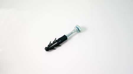 The expansion bolt shield on a white background. Construction tools.