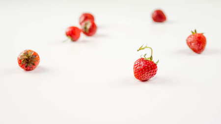Strawberries are scattered, on a white background, a lot of strawberries.の写真素材