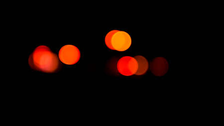 Bright red bokeh lights on a black background