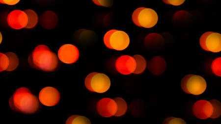 Red bokeh lights on a black background