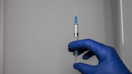 Flu shot. Flu vaccine in a syringe at a doctor. 14.01.2020 Ukraineのeditorial素材