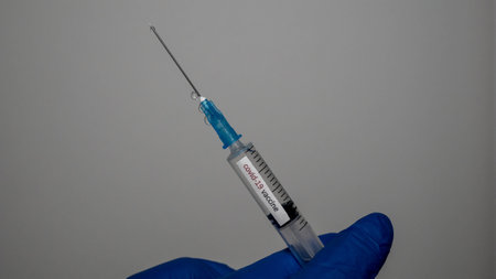 Medicine for influenza, vaccine, the doctor holds a vaccine in a syringe in his hand. Editorial covid photo. 14.01.2020 Ukraineのeditorial素材