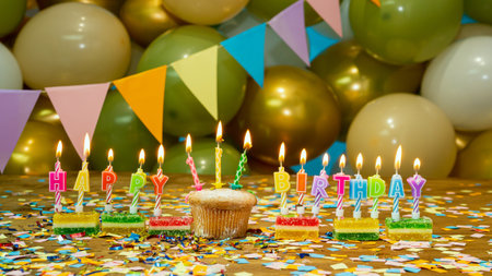 Happy birthday postcard, festive cupcake with candles and birthday decorations on a blue background. Decorations congratulations.の写真素材
