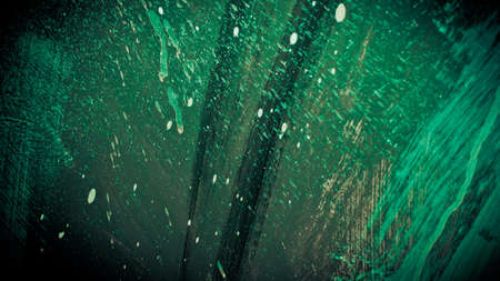 Beautiful gloomy green background with cracked paint. Copy space. Abstract background of creative...