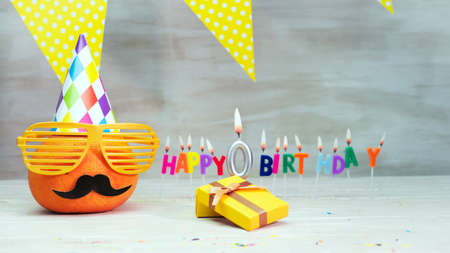 Happy birthday card with number 0. Copy space, beautiful birthday greeting character with mustache in glasses. Decorations with candles from numbers for a birthday.の写真素材