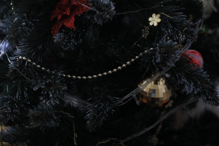 Christmas tree with decorations and ornaments, closeup of photoの写真素材