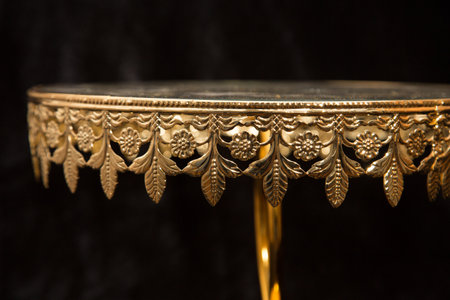 Luxury golden table on a black background, close-upの写真素材