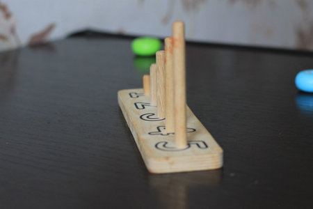 Wooden dominoes on the table, closeup of photo