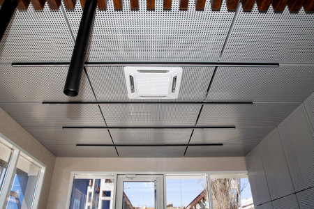 Interior of a modern house with ceiling lights and ventilation system.