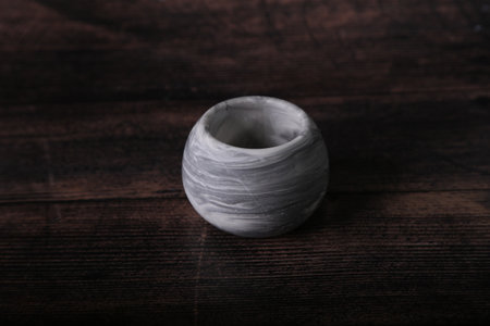 White ceramic vase on wooden background. selective focus. Shallow depth of field. Toned.