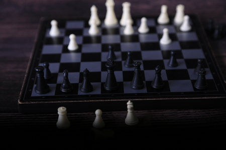 Chess board with figures on wooden background. selective focus. Toned.の写真素材