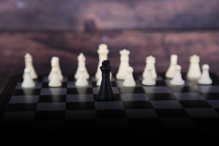 Chess board and chess pieces on a dark background. selective focus.の写真素材