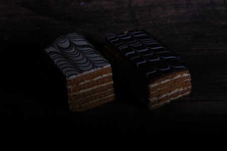 Delicious cake on wooden table. dark background. selective focus.の写真素材
