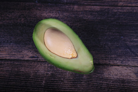 Avocado on a wooden background, top view, close-upの写真素材