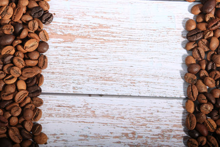 Coffee beans on white wooden background. top view with copy spaceの写真素材