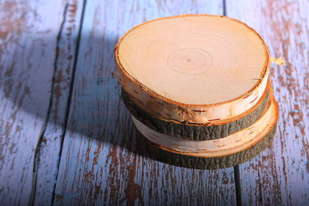 Wooden stamp on color wooden background, close-up, selective focusの写真素材