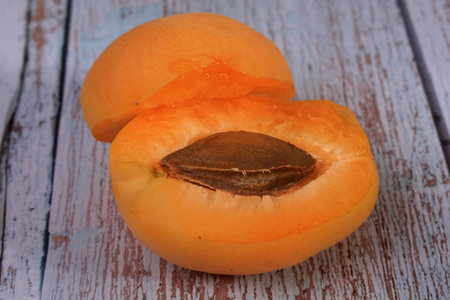 Apricot on a wooden background. Ripe apricots.