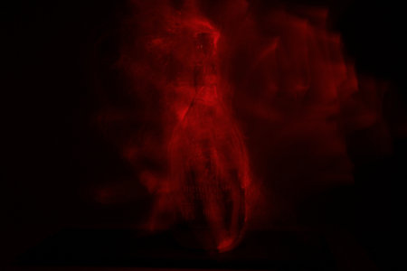 Red smoke on a black background. Abstract background. Texture. Design element.の写真素材