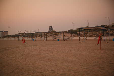Children play on the beach at sunset. Summer vacations on the sea.の写真素材
