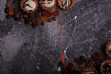 Coffee with candied fruits on grunge background, top viewの写真素材
