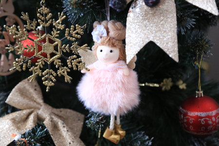 Christmas tree decoration with angel doll and snowflakes on the treeの写真素材