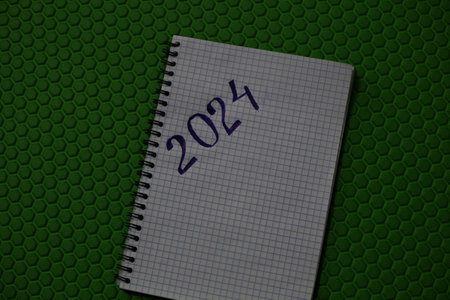 Notebook with the inscription 2024 on a green background.の写真素材