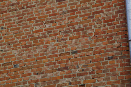 Old red brick wall texture background. Brickwork of an old building.