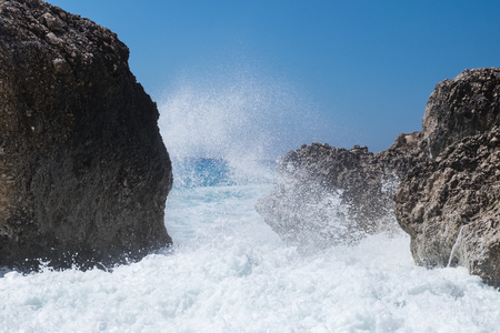 Stormy ocean striking the rocksの写真素材