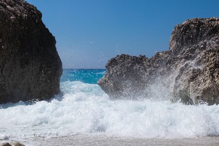 Stormy ocean striking the rocksの写真素材