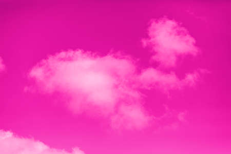 pink sky with pink fluffy cloudsの写真素材