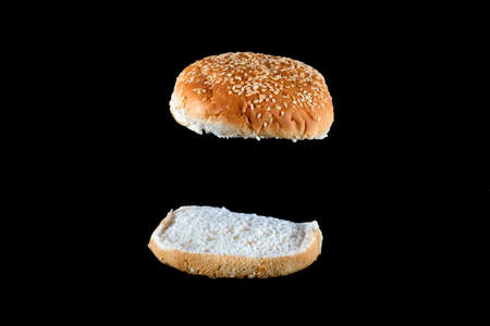 sesame seeds hamburger bread on a black backgroundの写真素材