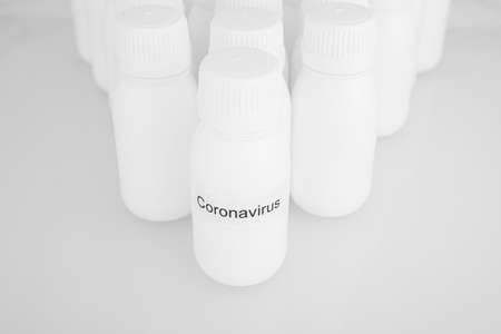 white canister of coronavirus on a white backgroundの写真素材