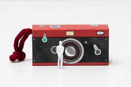 toy photo camera with people on a white backgroundの写真素材