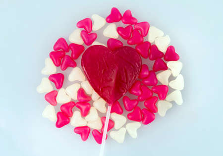 red and white sugar hearts on a white background