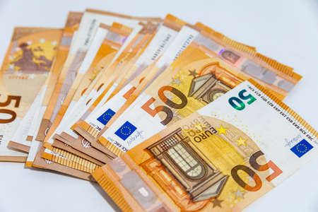 A pile of 50 euro notes in the foreground