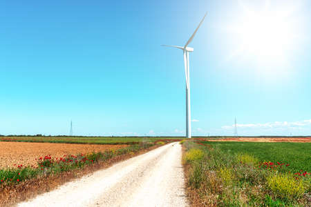 windmill tower in the flowery fields of Castilla and Leon in Spain