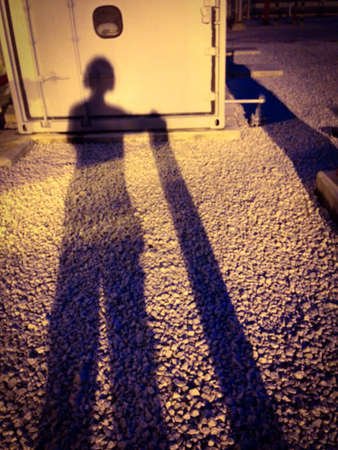 Shadow of man working on siteの素材