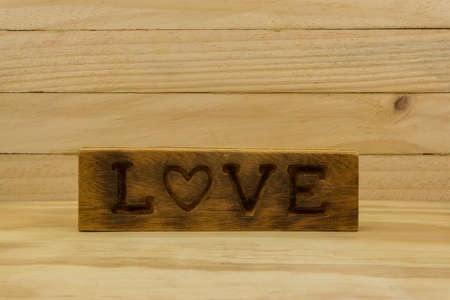 Love word in wooden backgroundの写真素材